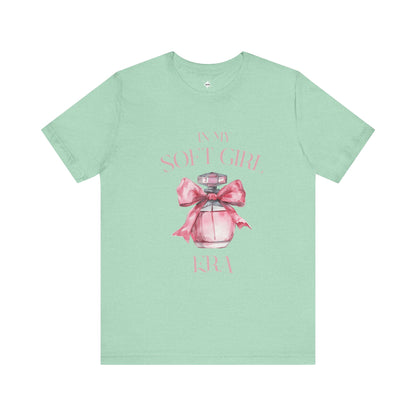 front of a mint green in my soft girl era t shirt with a pink perfume bottle with a pink bow