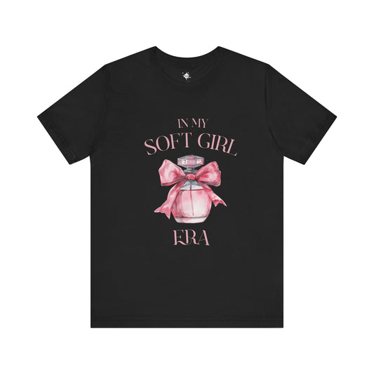 front of a black in my soft girl era t shirt with a pink perfume bottle with a pink bow