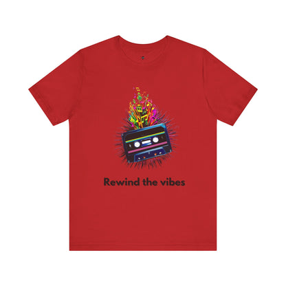 red t-shirt featuring a retro cassette tape design with musical notes and the phrase 'Rewind the Vibes,' perfect for 90s music lovers and nostalgic style