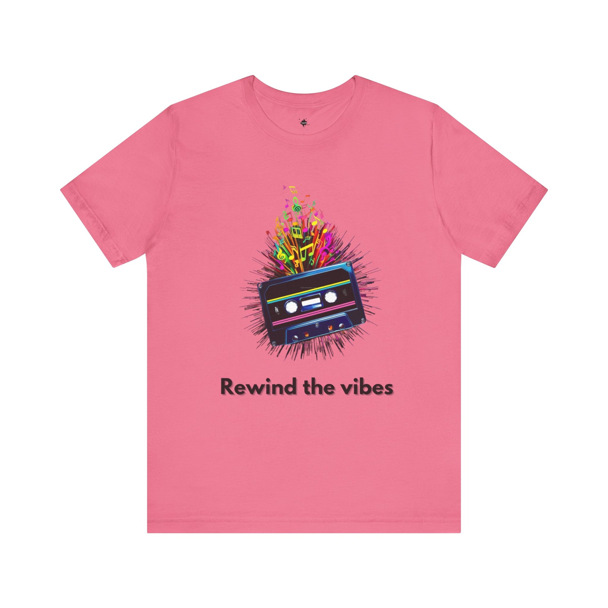 Pink t-shirt featuring a retro cassette tape design with musical notes and the phrase 'Rewind the Vibes,' perfect for 90s music lovers and nostalgic style