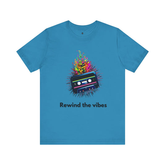 aqua t-shirt featuring a retro cassette tape design with musical notes and the phrase 'Rewind the Vibes,' perfect for 90s music lovers and nostalgic style