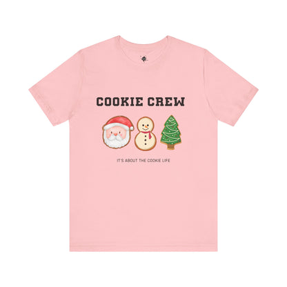 pink front t shirt with cookie crew it's about the cookie like with a santa, snowman and christmas tree cookie image