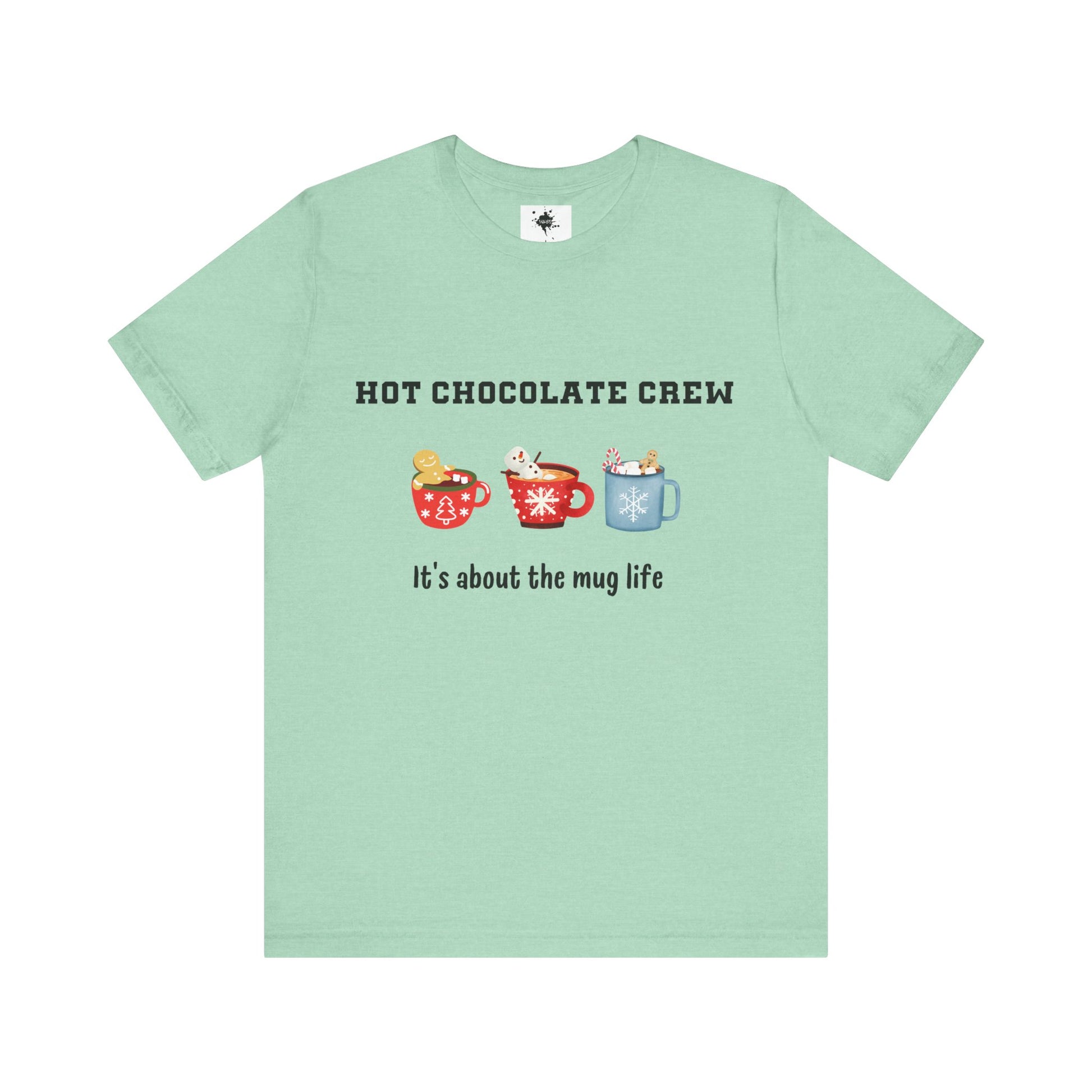 mint green t-shirt featuring three cups of hot chocolate and the phrase 'It's about the mug life,' perfect for cozy winter vibes and casual holiday style