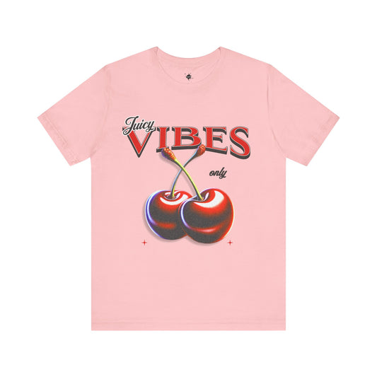 Pink t-shirt featuring a vibrant cherry graphic and the phrase 'Juicy Vibes Only,' perfect for adding a playful and fun touch to casual summer style.